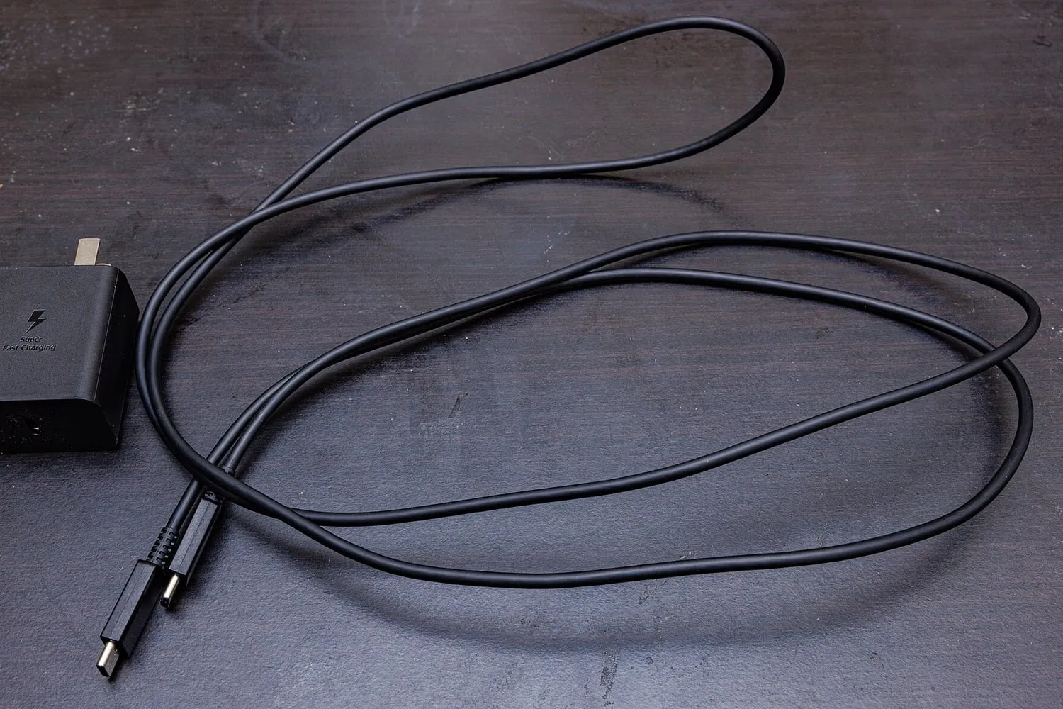 USB-C cables and a mains charger photographed together